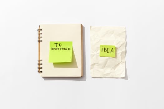 Minimalist flat lay of a notebook and sticky notes for idea organization.